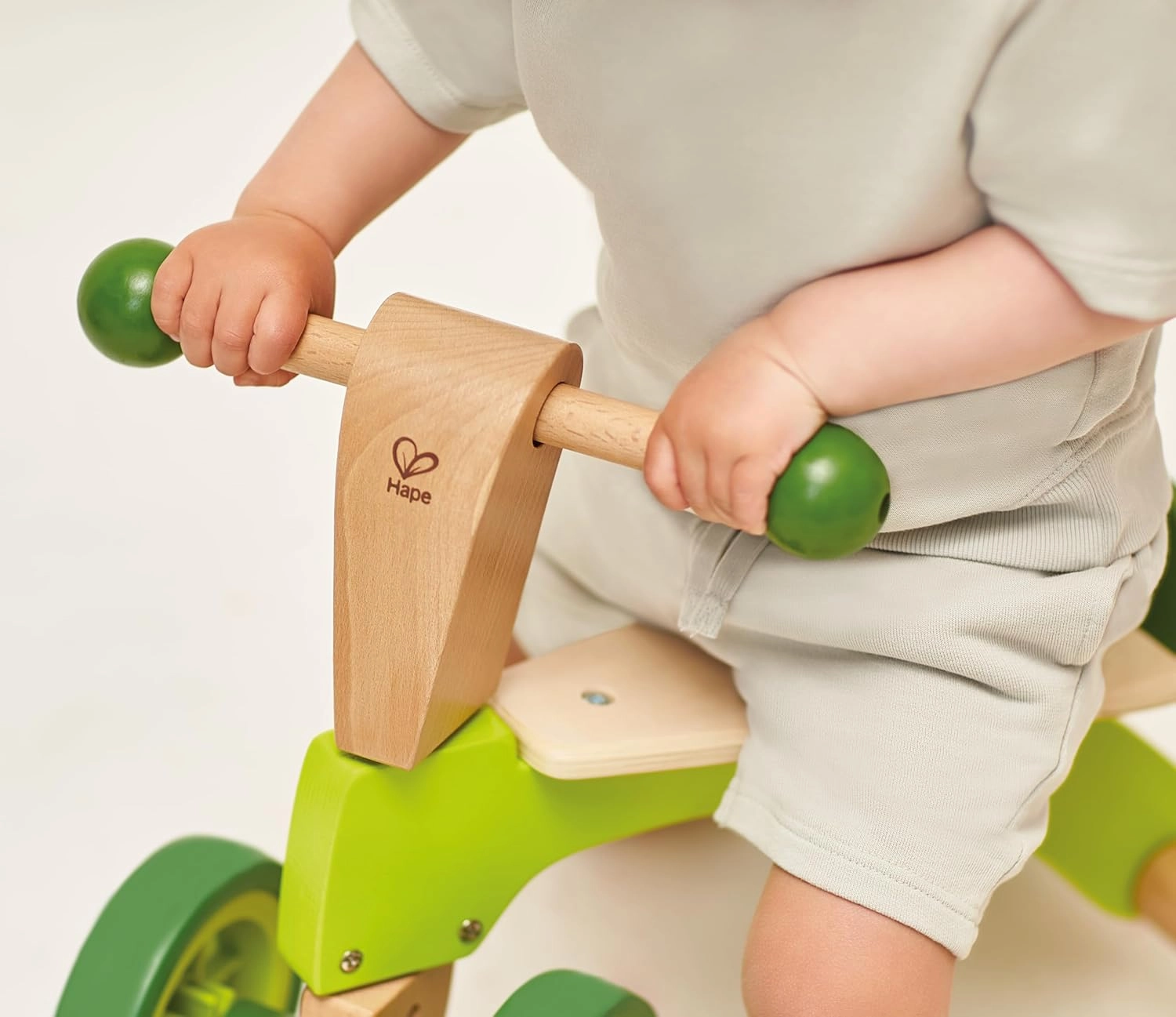 Hape Scoot Around Ride On Wood Bike | Award Winning Four Wheeled Wooden Push Balance Bike Toy for Toddlers with Rubberized Wheels, Bright Green