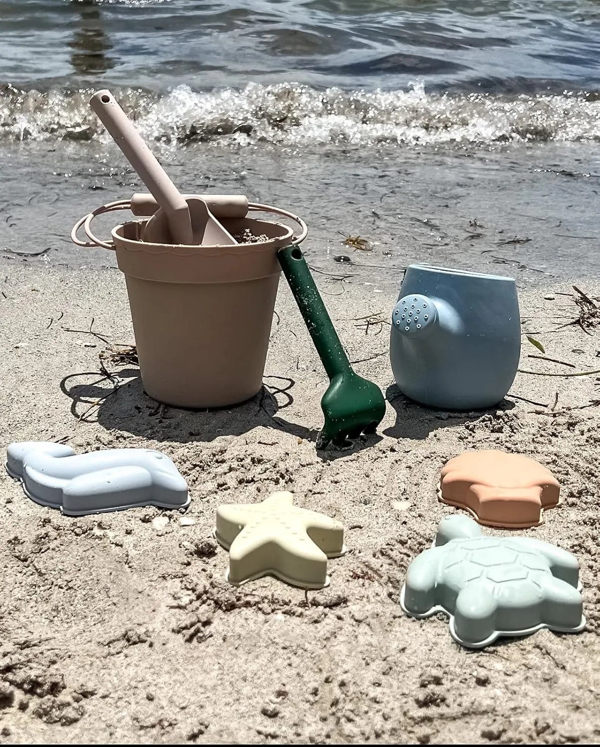 Silicone Beach Toys - Beach Bucket Set with Shovel, 4 Sand Molds - Travel-Friendly Kids Sand Toys in Net Carrying Bag - Safe Baby Sand Toys - Dishwasher-Safe (Ocean Blue)